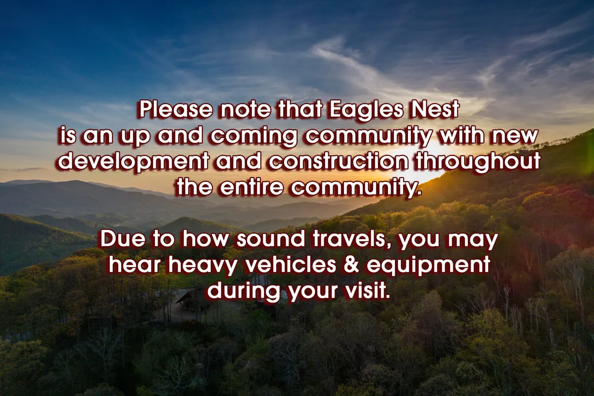 A panoramic view of the rolling mountain landscape at sunset, featuring lush greenery and a dramatic sky. The tranquility and beauty of the setting invite exploration, hiking, and quiet reflection—conveying the allure of the Eagles Nest environment beyond the amenities themselves.